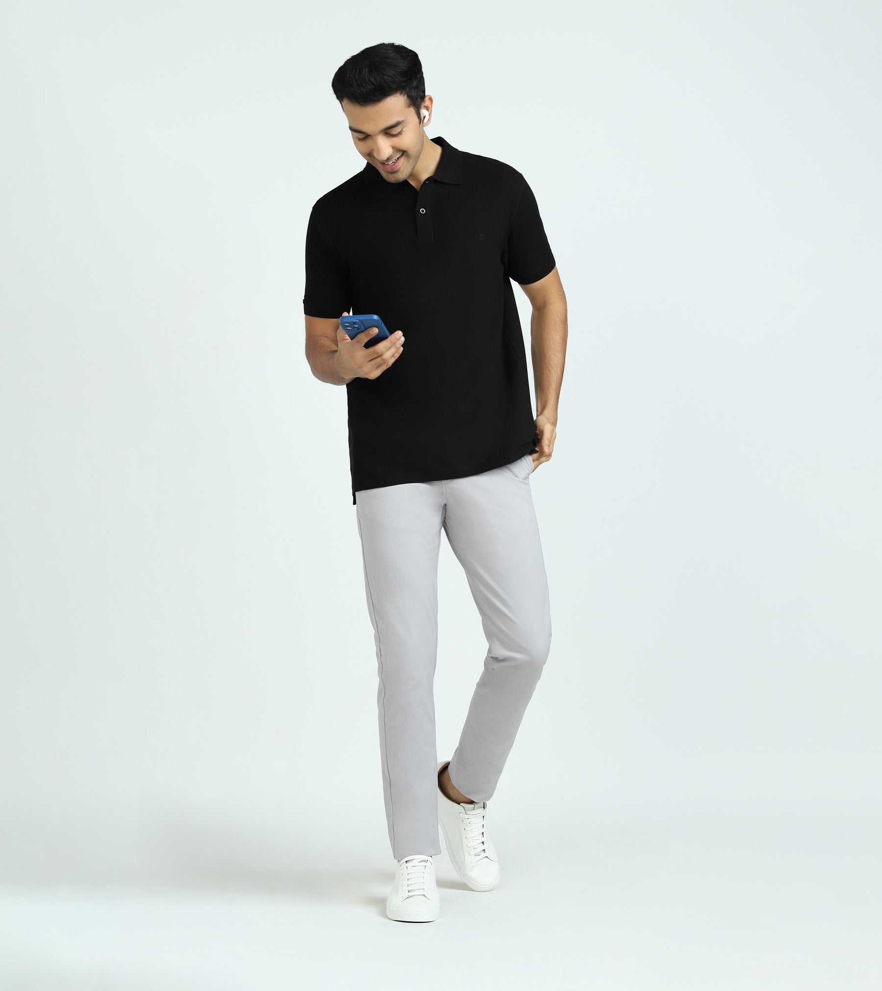 Men's Black Polo, Grey Dress Pants, White Leather Low Top Sneakers, Black  Socks | Lookastic